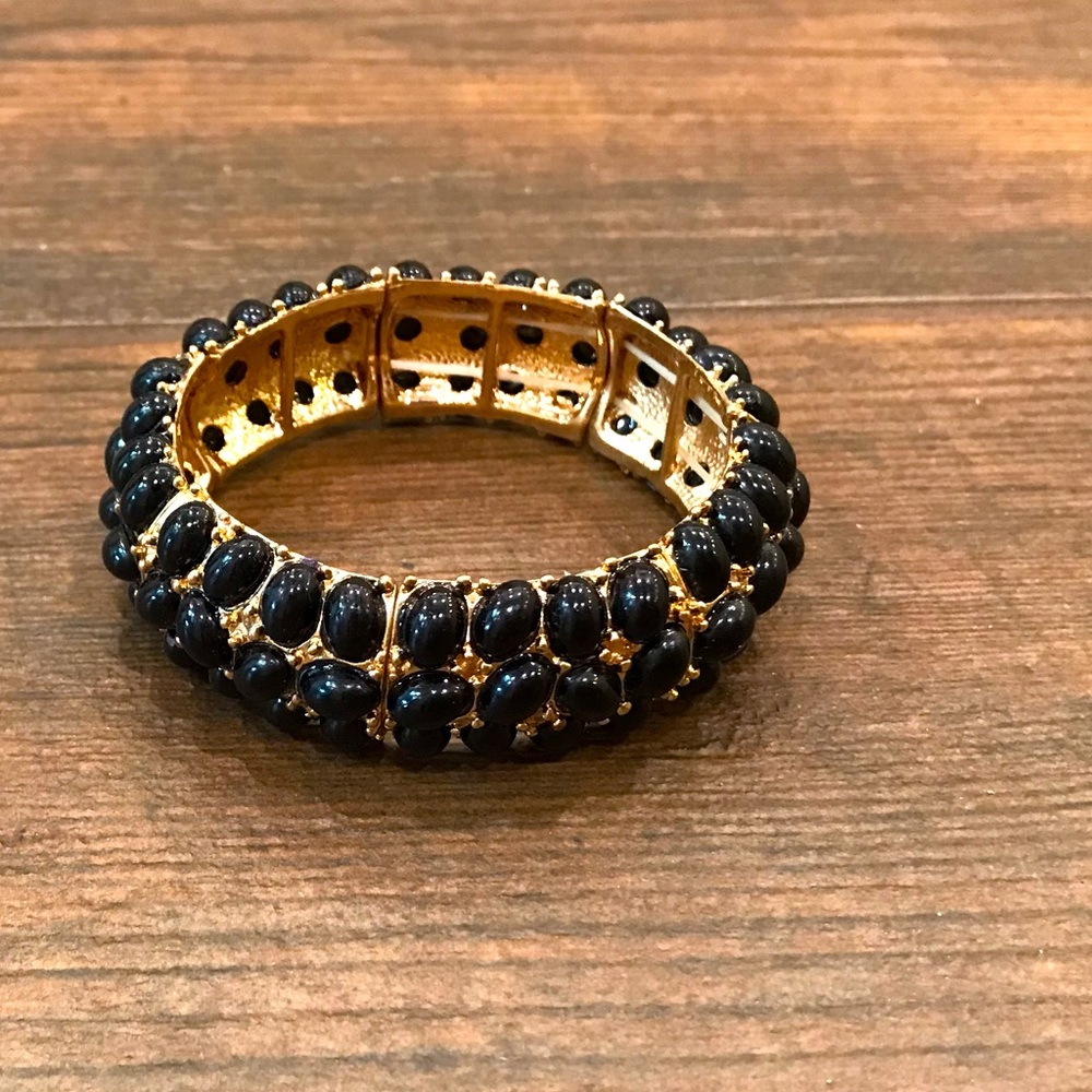 Black bead and gold metal bracelet